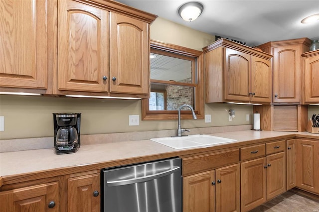 kitchen featuring a sink, light countertops, and dishwasher