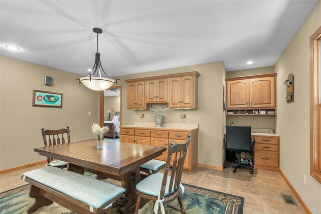 dining area with light tile patterned floors