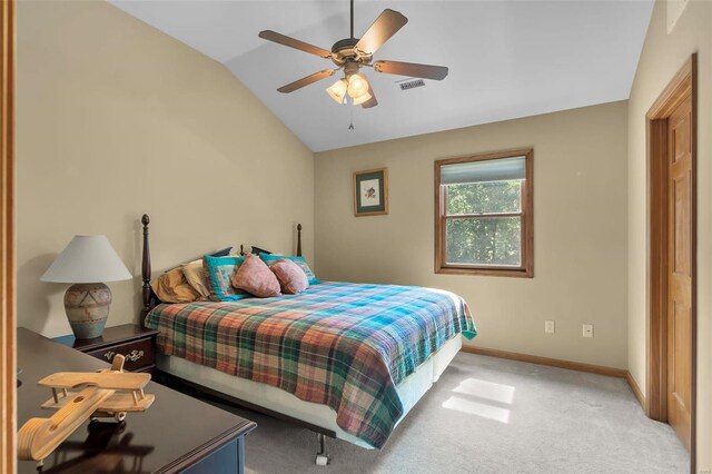 carpeted bedroom featuring ceiling fan and vaulted ceiling