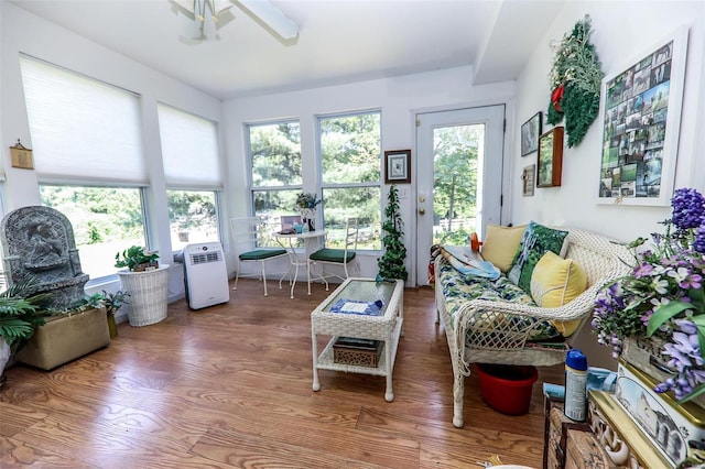 sunroom featuring a wealth of natural light and ceiling fan