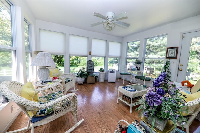 sunroom with ceiling fan and plenty of natural light