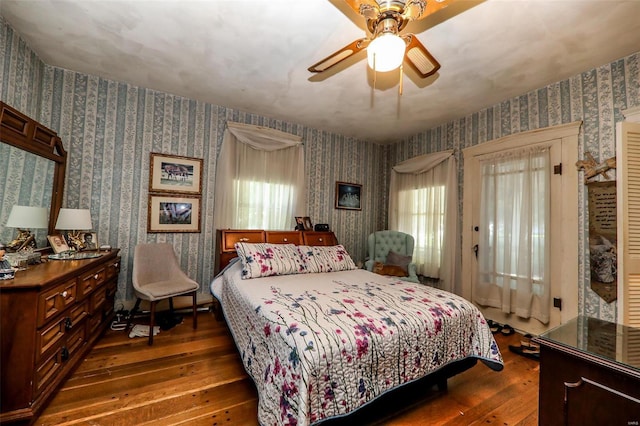 bedroom featuring dark hardwood / wood-style flooring and ceiling fan