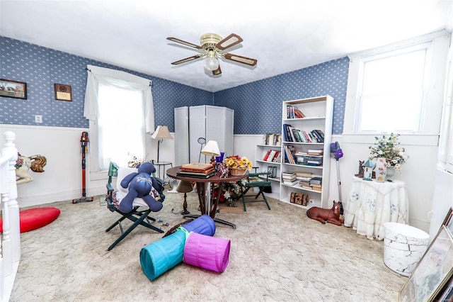 game room with light carpet and ceiling fan