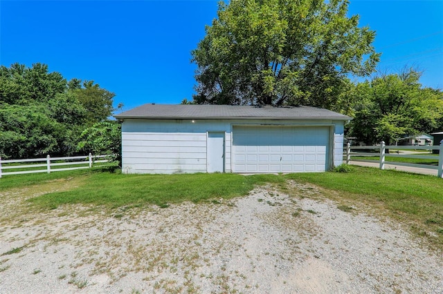 garage with a yard