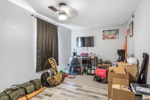 interior space with light hardwood / wood-style floors and ceiling fan