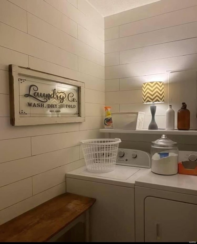 clothes washing area featuring washing machine and dryer