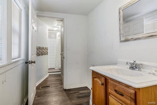 bathroom featuring vanity, a shower with curtain, and hardwood / wood-style flooring