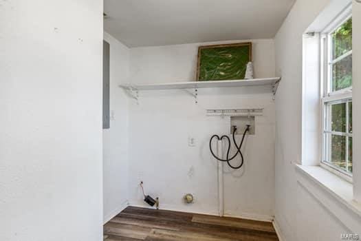 laundry area featuring a wealth of natural light, washer hookup, and dark hardwood / wood-style flooring