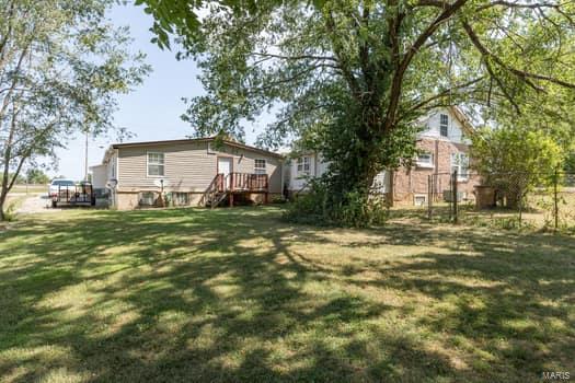 view of yard with a deck