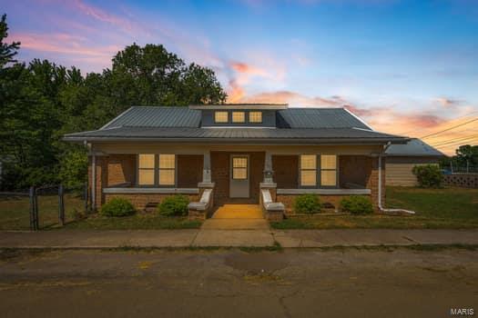 view of front of home featuring covered porch