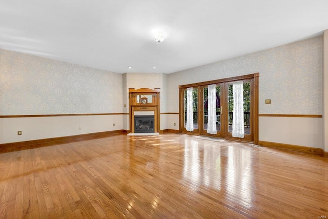 unfurnished living room featuring light hardwood / wood-style flooring