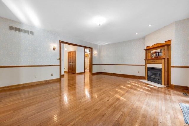 unfurnished living room with light wood-type flooring