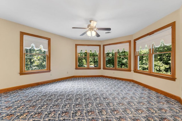 empty room featuring ceiling fan