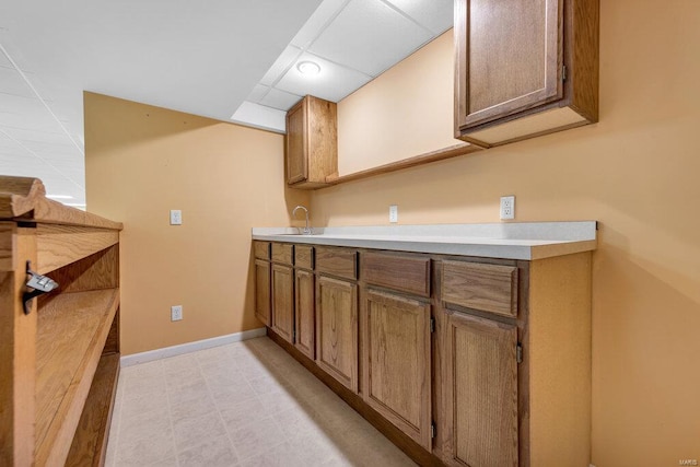 kitchen featuring a drop ceiling