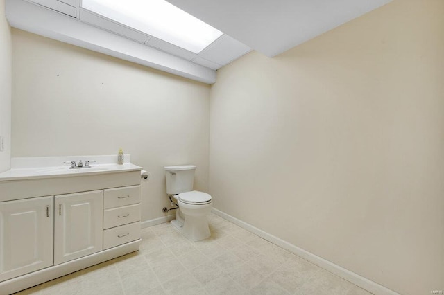 bathroom featuring toilet and vanity