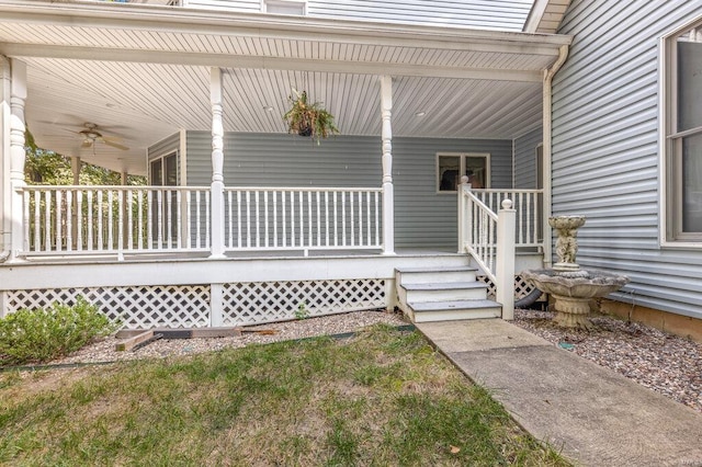 entrance to property featuring ceiling fan and a porch