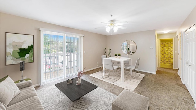 living room featuring light carpet and ceiling fan