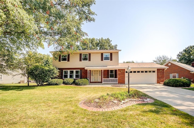 front of property featuring a garage, a front lawn, and covered porch