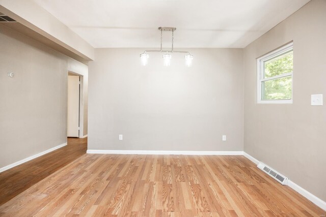 spare room with light wood-type flooring