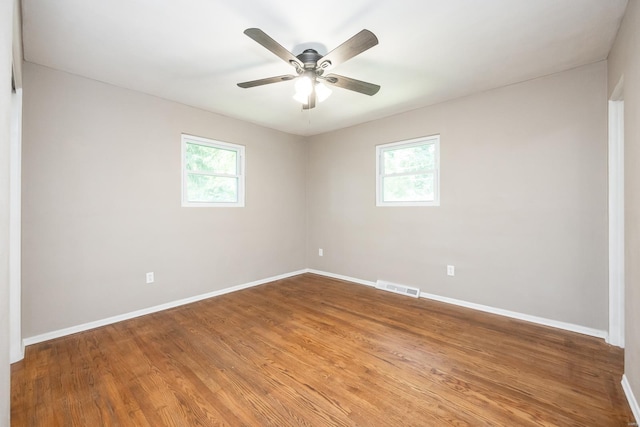 unfurnished room featuring hardwood / wood-style floors and ceiling fan