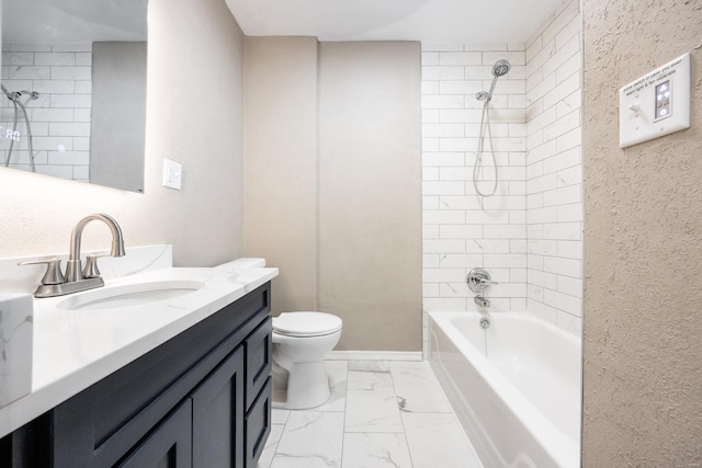 full bathroom featuring toilet, vanity, and tiled shower / bath