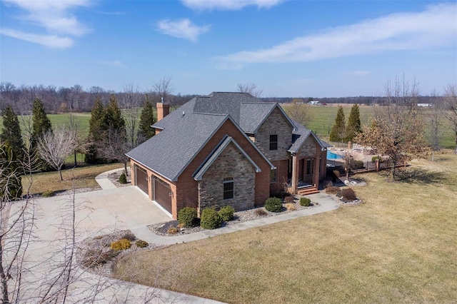 view of front facade with stone siding, concrete driveway, a front yard, a shingled roof, and a garage