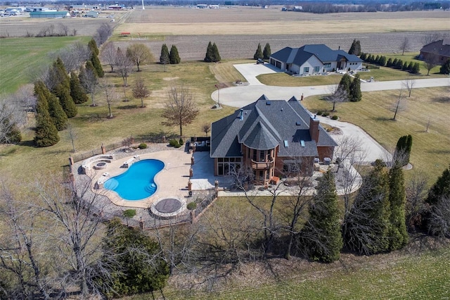 birds eye view of property featuring a rural view