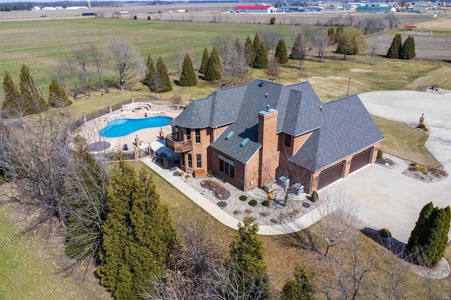 birds eye view of property featuring a rural view