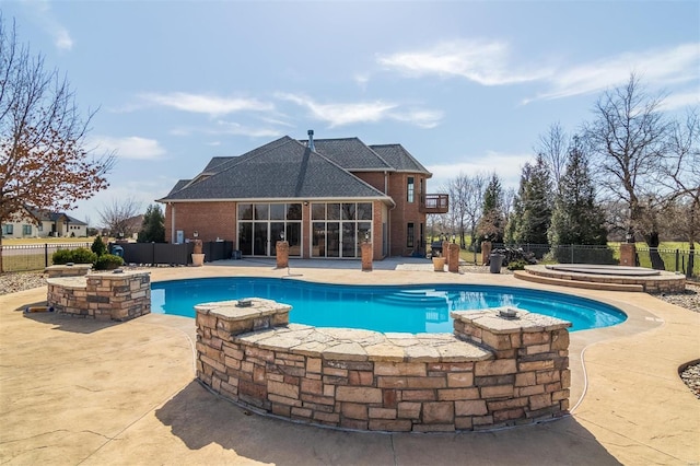 view of swimming pool with a patio area, a fenced in pool, a jacuzzi, and fence