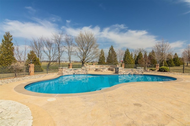 view of pool featuring a patio area, a fenced in pool, and fence