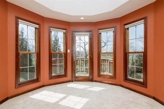 doorway to outside featuring carpet flooring, recessed lighting, and baseboards