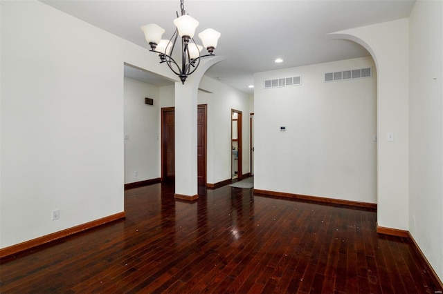 spare room featuring visible vents, baseboards, and a chandelier