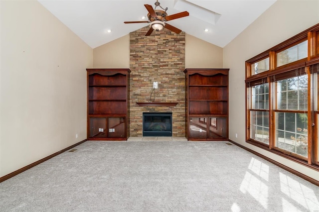 unfurnished living room featuring carpet, a ceiling fan, baseboards, high vaulted ceiling, and a stone fireplace