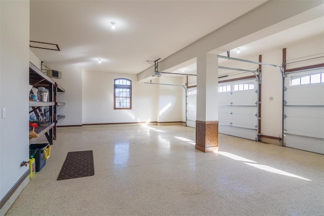 garage featuring baseboards and a garage door opener