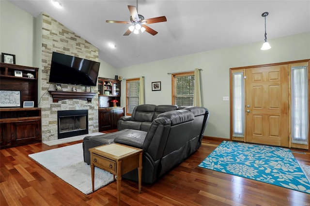 living room featuring a fireplace, dark hardwood / wood-style flooring, ceiling fan, and high vaulted ceiling