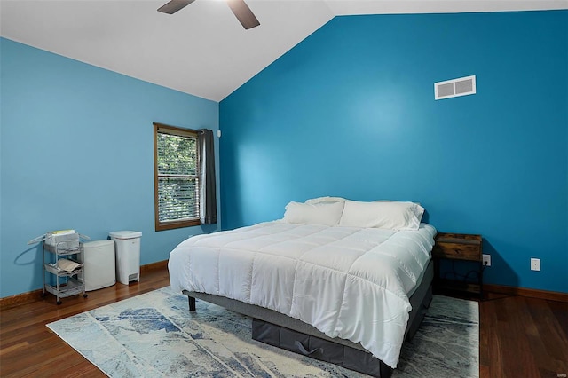 bedroom with lofted ceiling, dark wood-type flooring, and ceiling fan