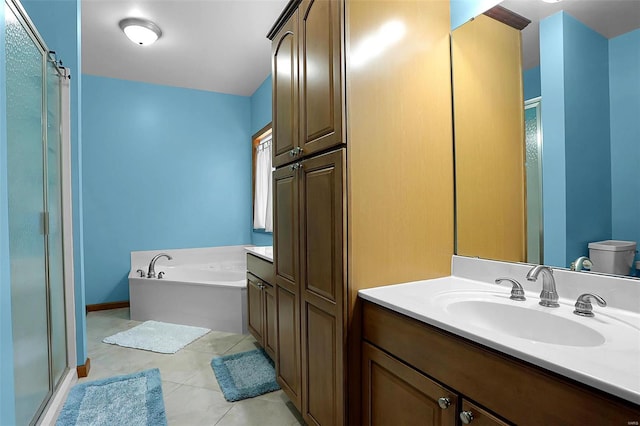 full bathroom with tile patterned flooring, toilet, vanity, and separate shower and tub