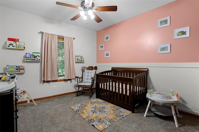 bedroom with carpet, ceiling fan, and a nursery area