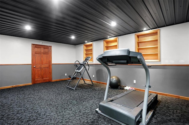 workout room featuring carpet flooring and built in features