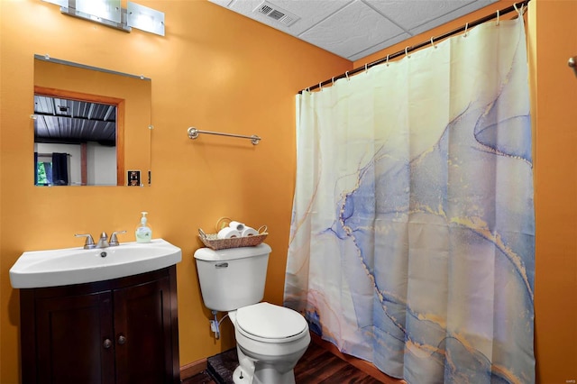 bathroom with hardwood / wood-style floors, vanity, toilet, and a shower with shower curtain