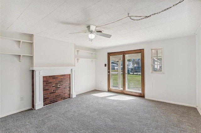 unfurnished living room with carpet, a fireplace, baseboards, and ceiling fan