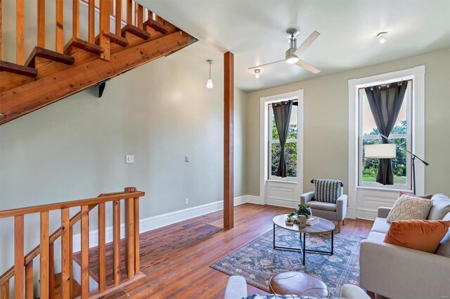 living room with track lighting, a healthy amount of sunlight, hardwood / wood-style floors, and ceiling fan