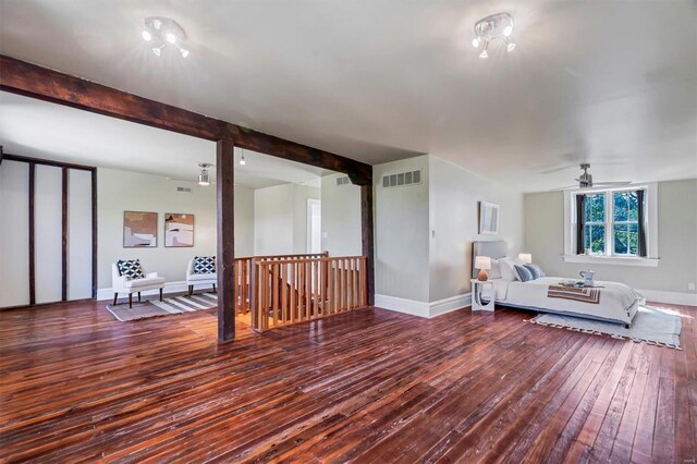 living room with beam ceiling and dark hardwood / wood-style floors