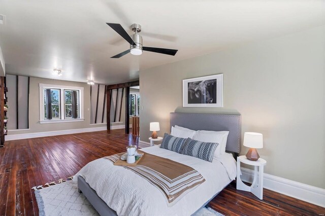 bedroom featuring dark wood-type flooring and ceiling fan