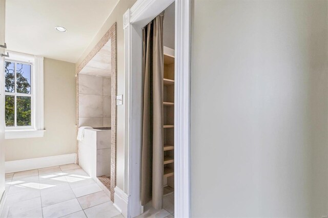 bathroom with tile patterned floors