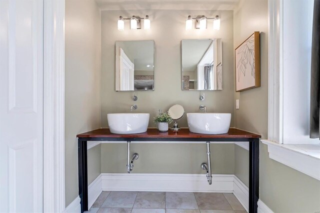 bathroom with tile patterned flooring and vanity