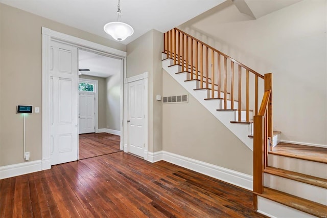 stairs with hardwood / wood-style flooring