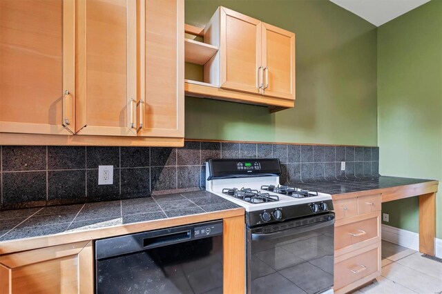 kitchen featuring black appliances, light tile patterned flooring, backsplash, and light brown cabinets