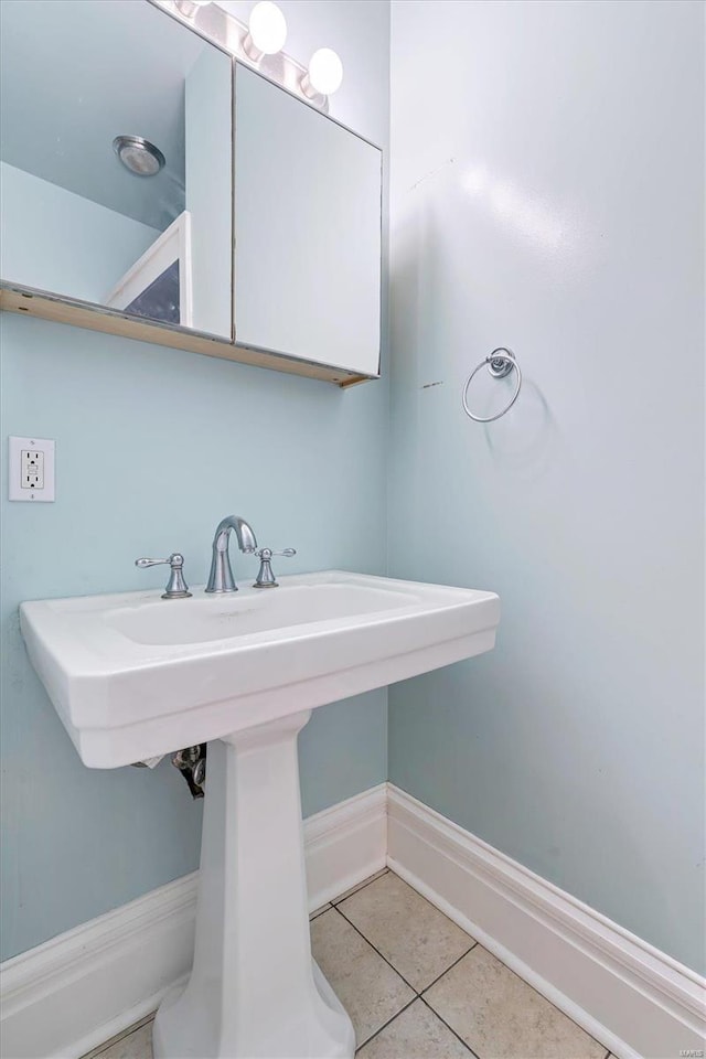 bathroom with tile patterned floors