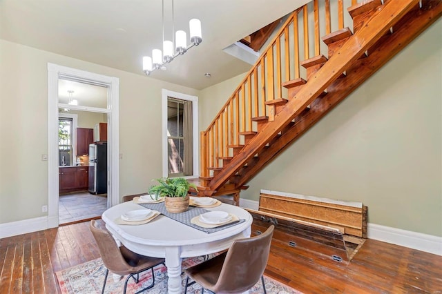 dining room featuring a notable chandelier and hardwood / wood-style floors